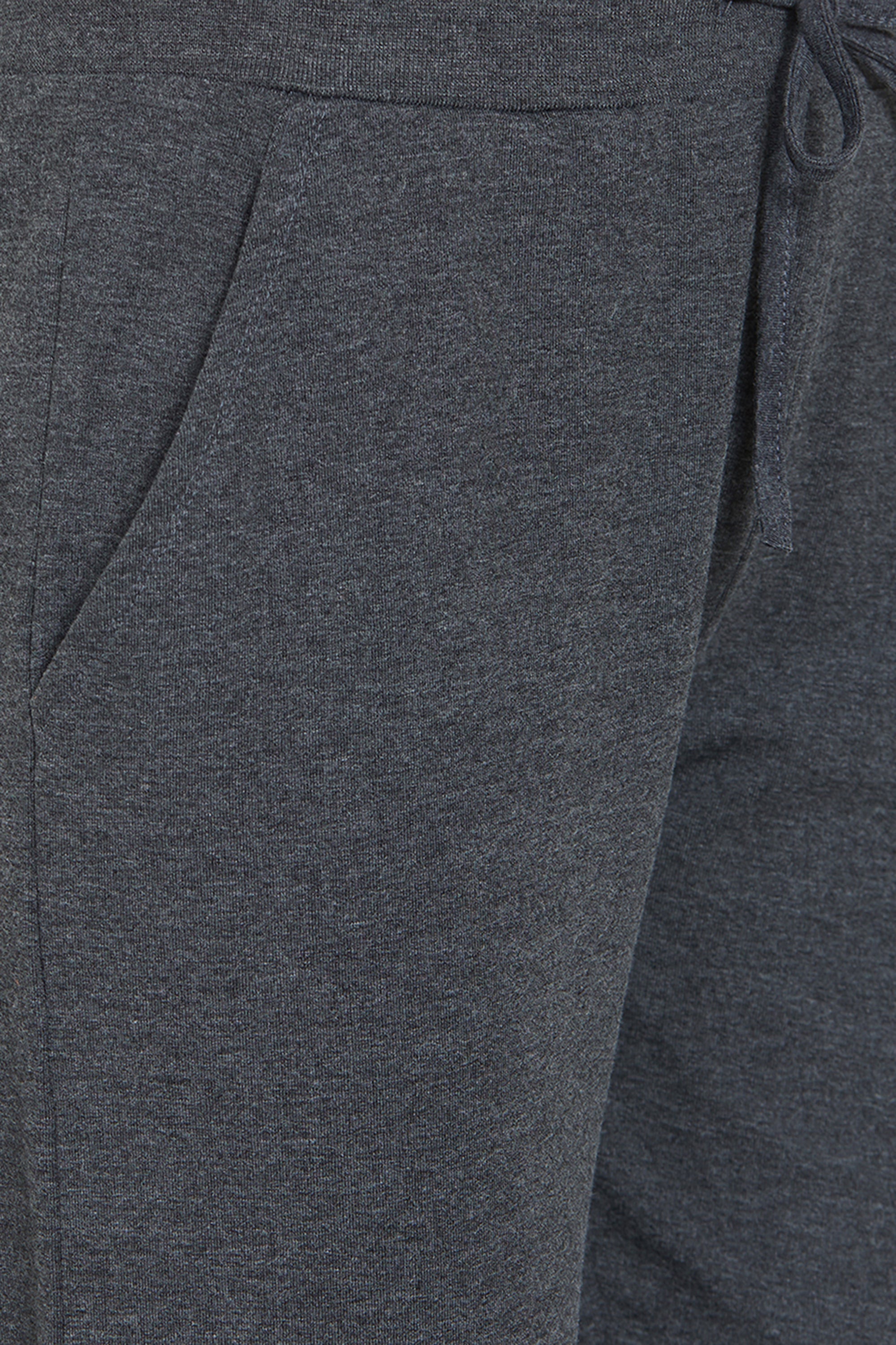 Close-up of Classic Joggers 81 in dark gray, featuring a pocket and an adjustable drawstring—ideal for comfortable loungewear.