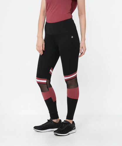 Woman wearing Sienna Black High Waisted Leggings and a matching top, standing against a plain white background.