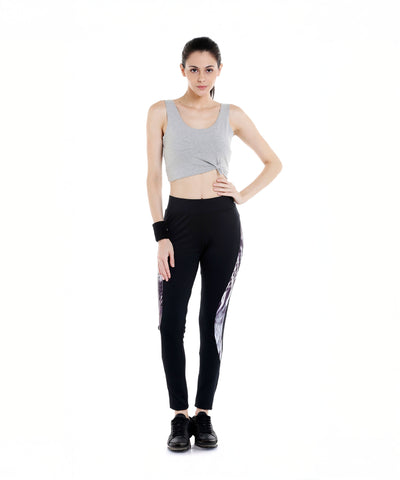 Woman in a gray crop top and Black Sports Leggings G2 with an elasticated waistband, standing against a white background, facing forward.