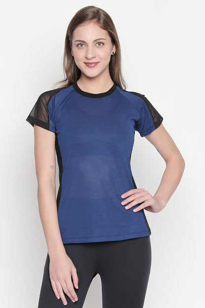 Woman wearing the Sportswear Dark Blue Tracksuit, smiling confidently against a plain background and highlighting her workout vibe.