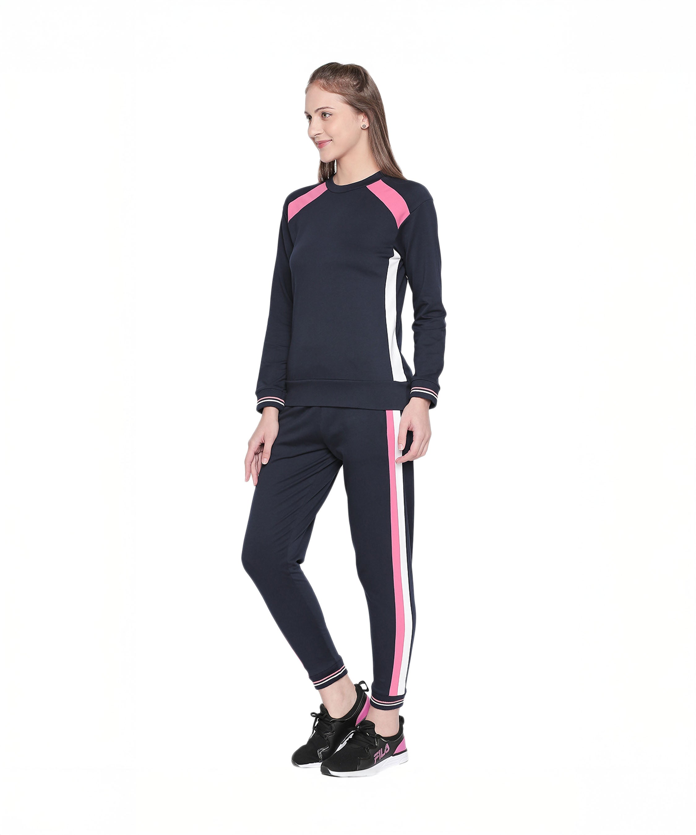 Model wearing the Sportswear Navy Blue Tracksuit with pink and white stripes, standing and smiling against a white background—ideal for home workouts or relaxing in stylish comfort.