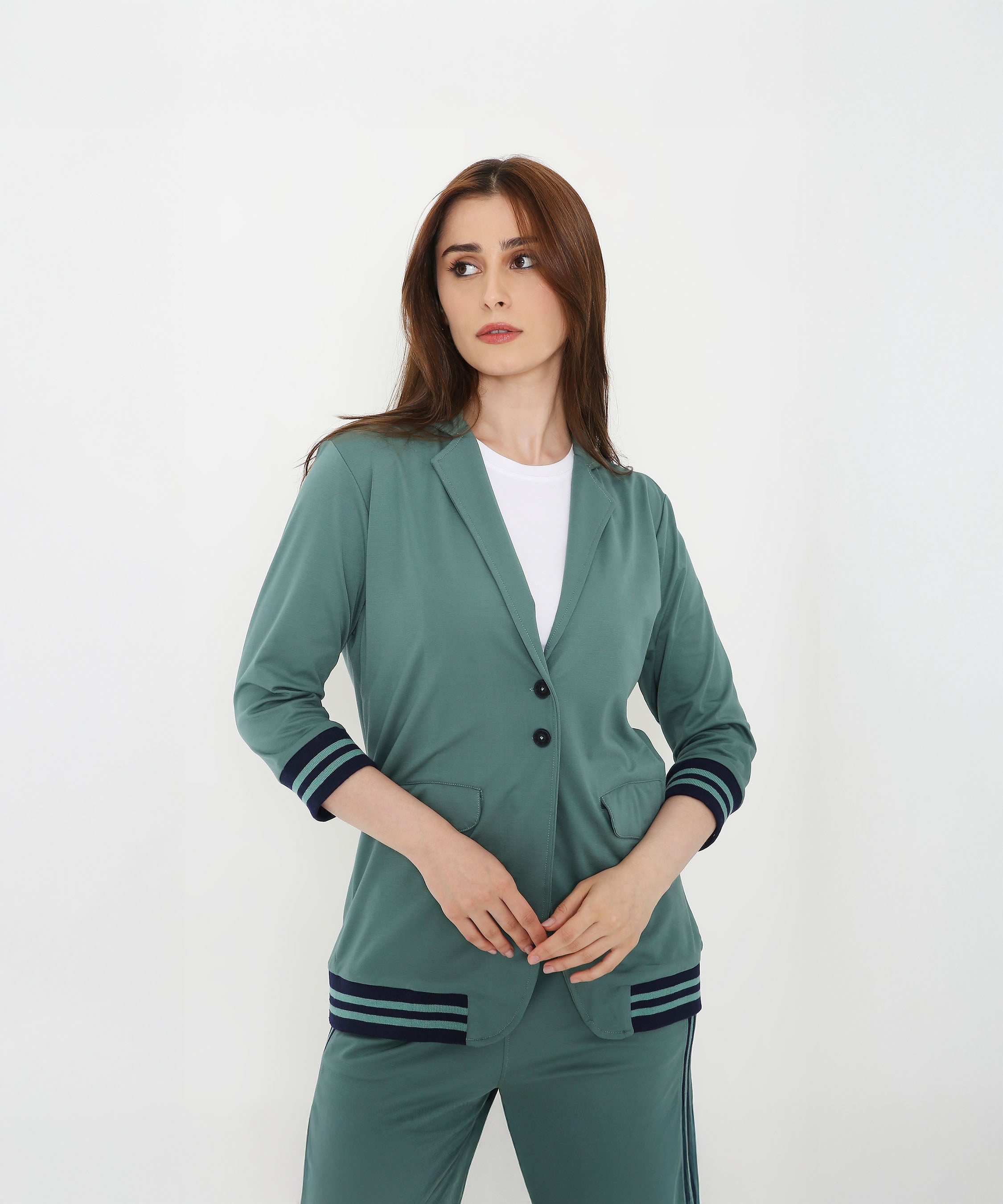 Woman wearing the Sage Green Athleisure Blazer Jacket and Track Set with striped cuffs and hem, standing against a plain white background.