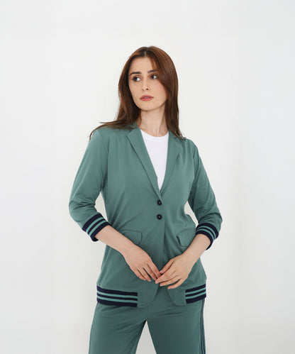Woman wearing the Sage Green Athleisure Blazer Jacket and Track Set with striped cuffs and hem, standing against a plain white background.