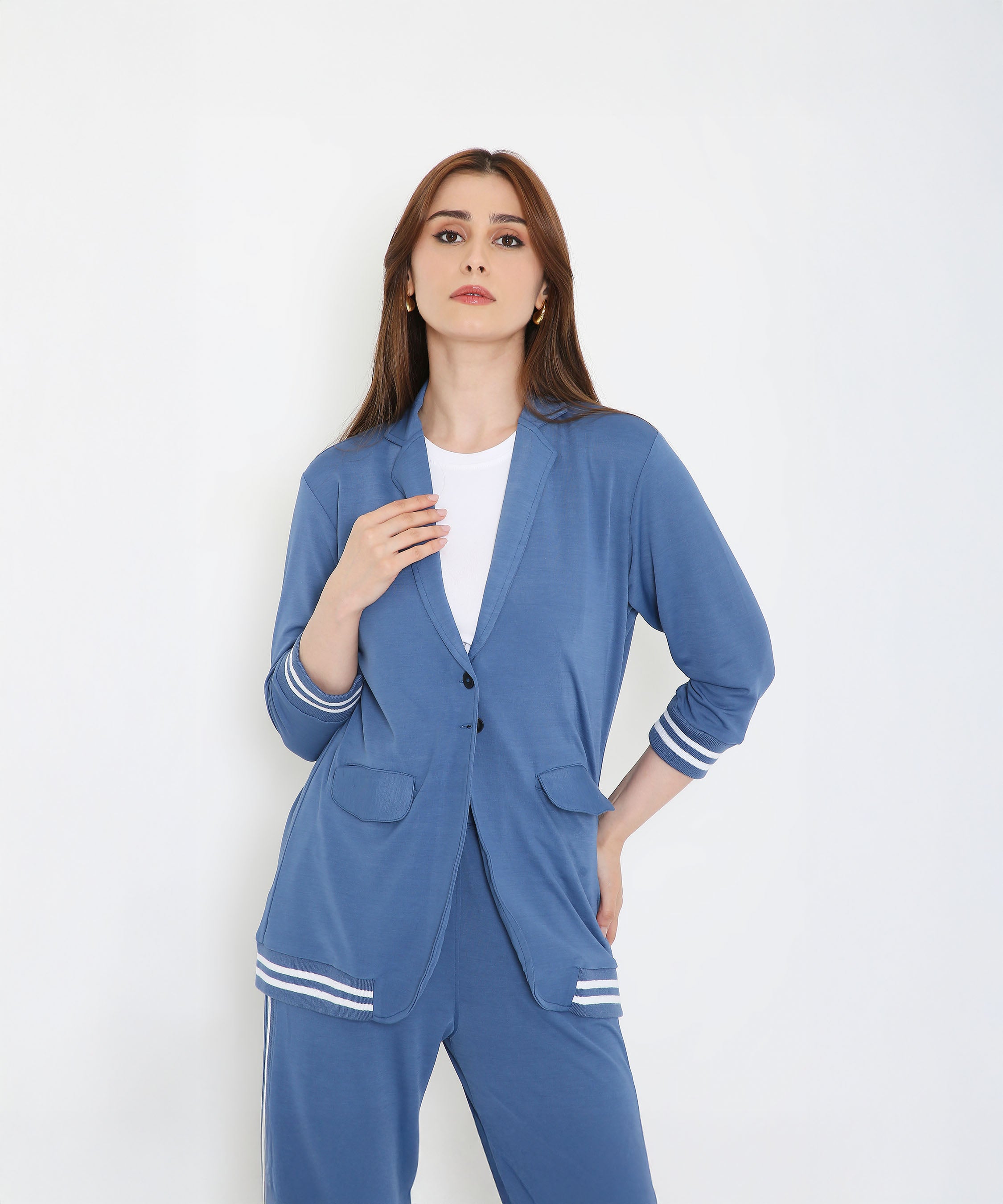Woman in the Atlantic Blue Athleisure Blazer Jacket and Track Set with white stripes, posing confidently against a plain white background.