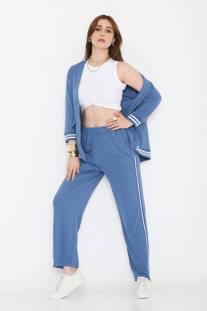 Woman wearing the Atlantic Blue Athleisure Blazer Jacket and Track Set with a white crop top and sneakers, posing against a white background.