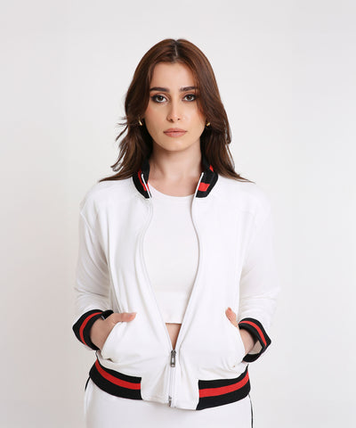 Model wearing the Two Piece Bold Contrast White Tracksuit in soft cotton-blend fabric with black and red trim, posing against a white background for a sporty-chic look.