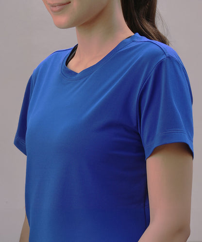 A woman wears the Blue Comfort T-Shirt, made from quick-drying fabric, shown from the shoulders up against a plain background.
