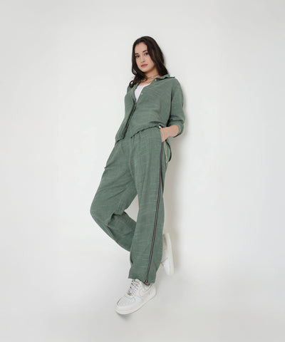 Model wears the Moss Green Breezy Cord Set with white sneakers, standing against a plain white background.
