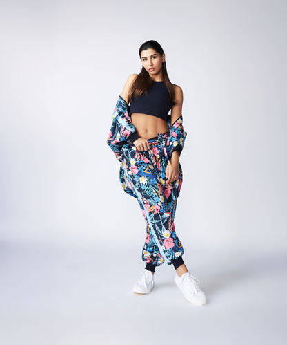 A woman poses confidently against a plain light background wearing a Navy Blue Crop Top.
