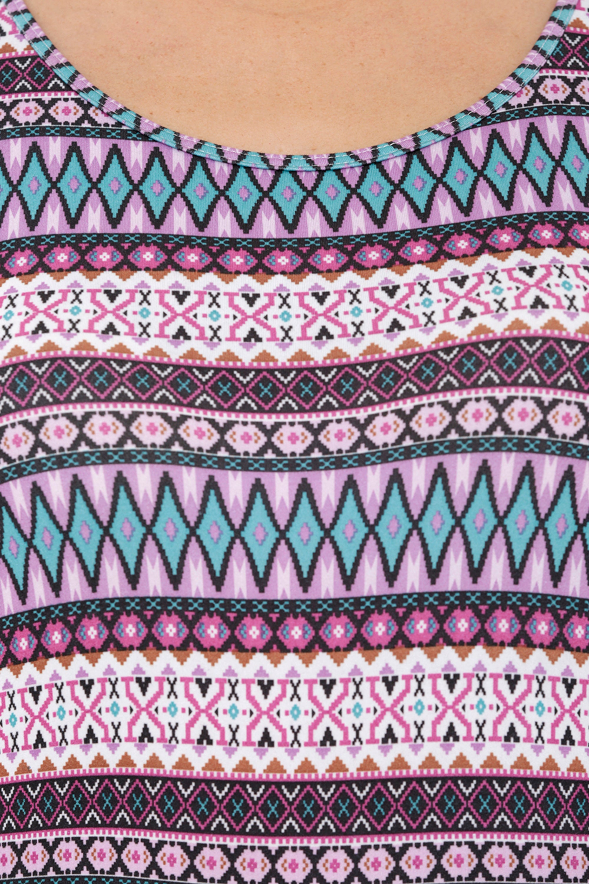 Close-up of the Multi-Print Sleeveless Tee With Built-In Bra Cups BT70, featuring vibrant geometric patterns in pink, teal, black, and white—ideal for intense workouts.