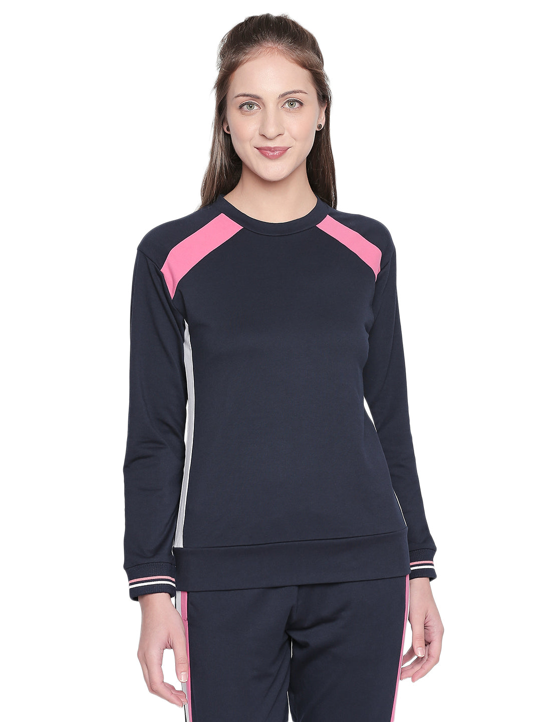 Woman wearing a Full Sleeve Navy Blue Round Neck Sweatshirt from Tuna London, standing and smiling against a white background—ideal for your next workout session.