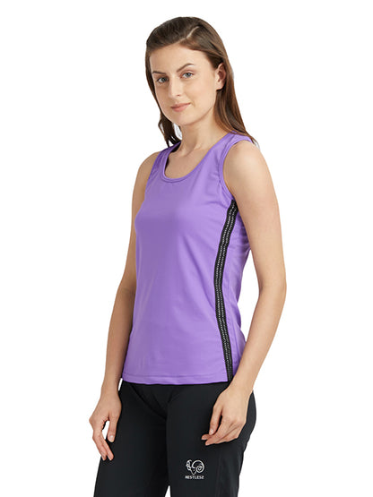 A woman in a purple round neck sleeveless top and black pants stands against a white background. Ideal for gym sessions, this moisture-wicking top keeps you comfortable during workouts.